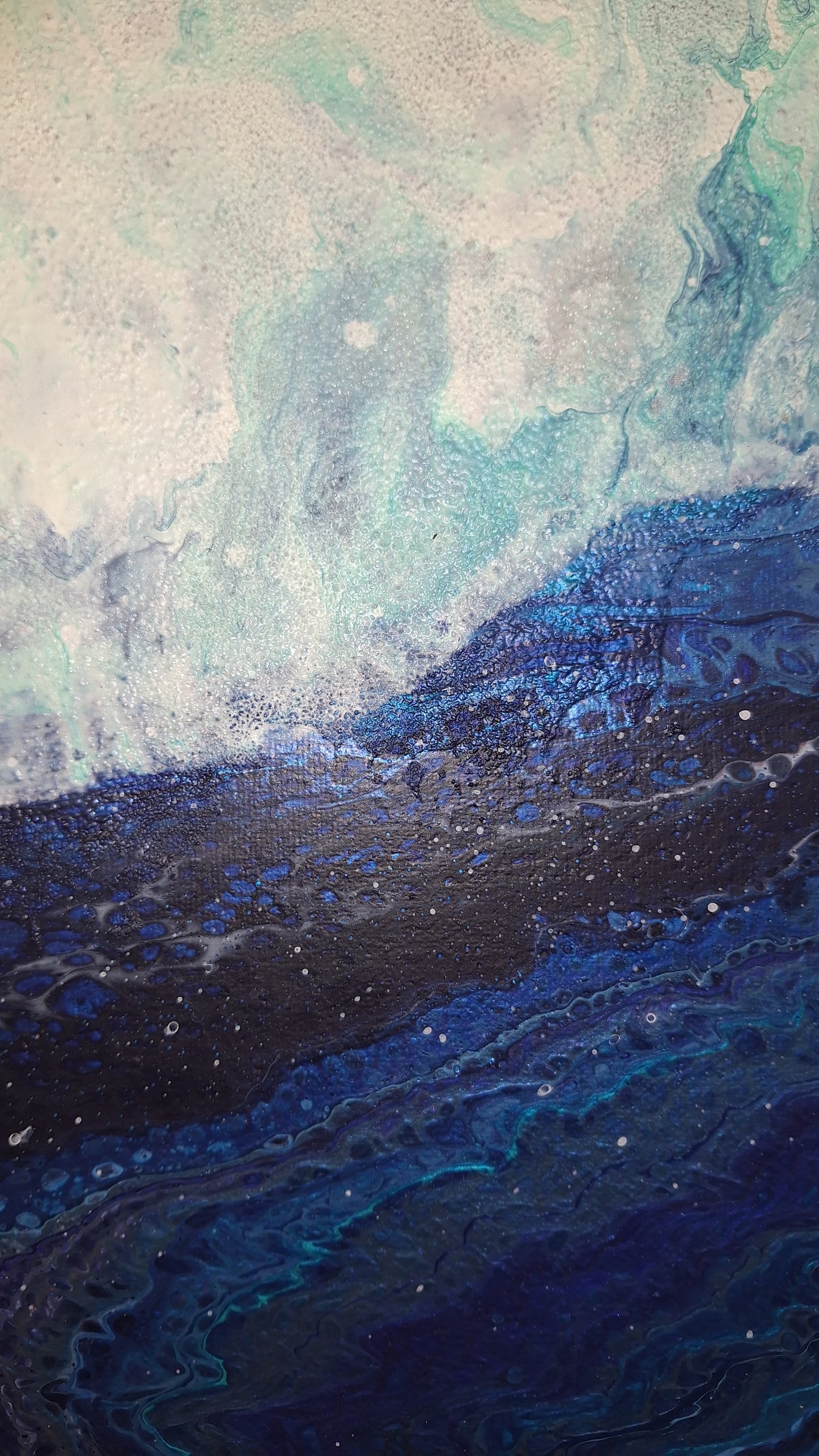 A new season is coming. Abstract Oceanic Art. Original piece close up. Blue ocean crashing waves onto a silver beach