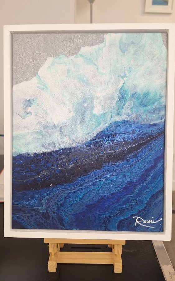 A new season is coming. Abstract Oceanic Art. Original piece on easel. Blue ocean crashing waves onto a silver beach